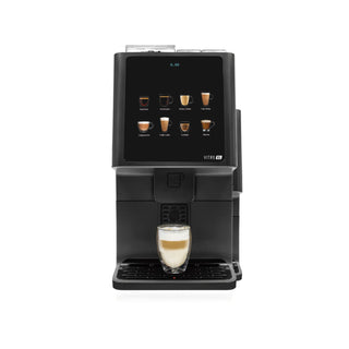 Azkoyen Vitro S1 Espresso dispensing a latte into a glass