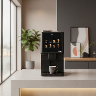 Azkoyen Vitro S1 Espresso on a modern office kitchen counter with a cup of coffee