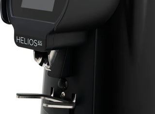 Close-up of the dosing spout and portafilter fork on the Eureka Helios 65 coffee grinder in black