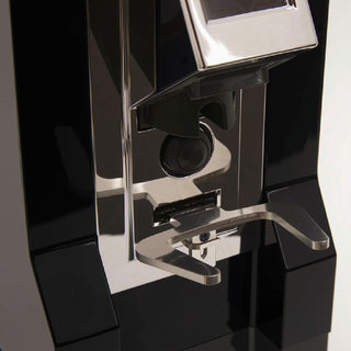 Close-up of the portafilter fork and dosing mechanism on the Eureka Mignon Specialita coffee grinder in black